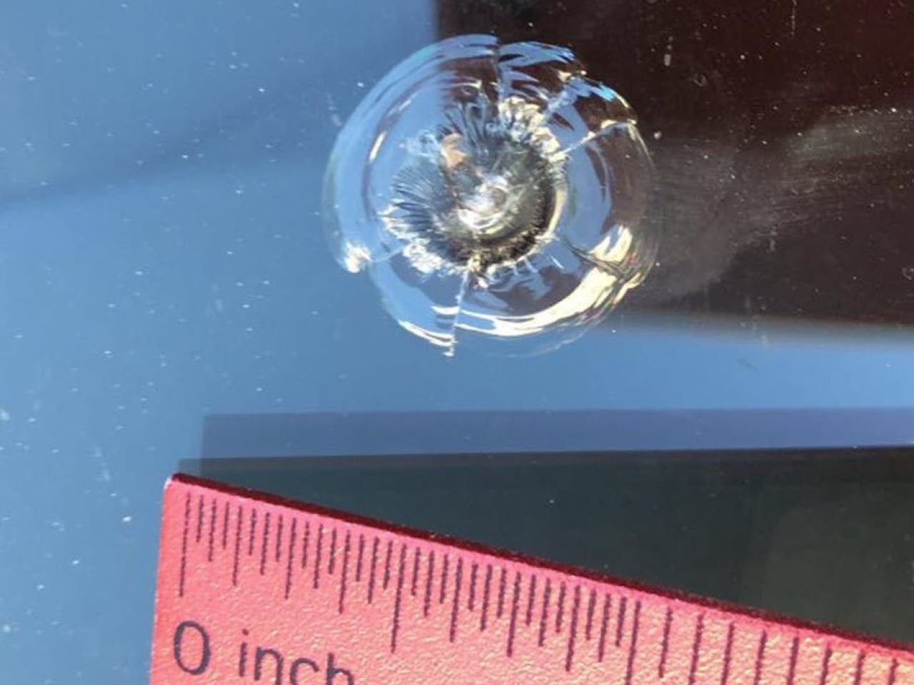 Image showing a windshield crack in a Half Moon shape.
