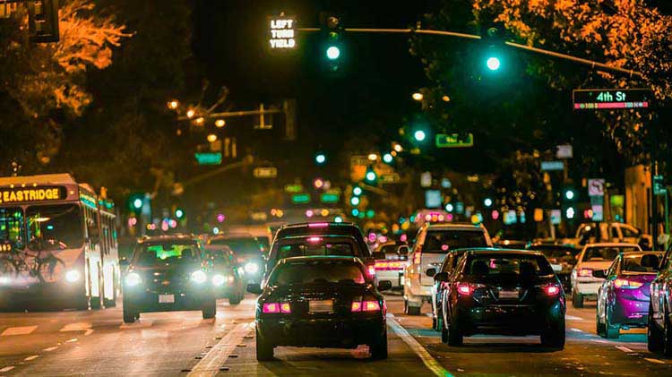 Traffic going through a green light.