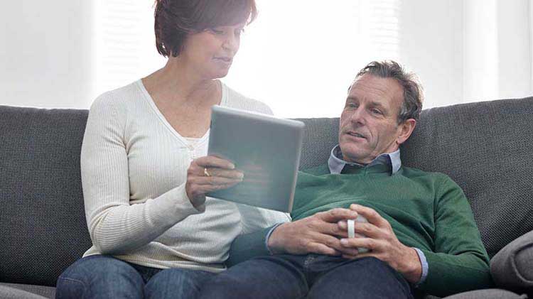 Couple looking at an investment portfolio.