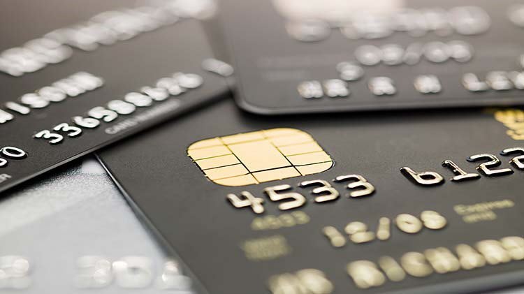 Multiple credit cards displayed on top of each other.