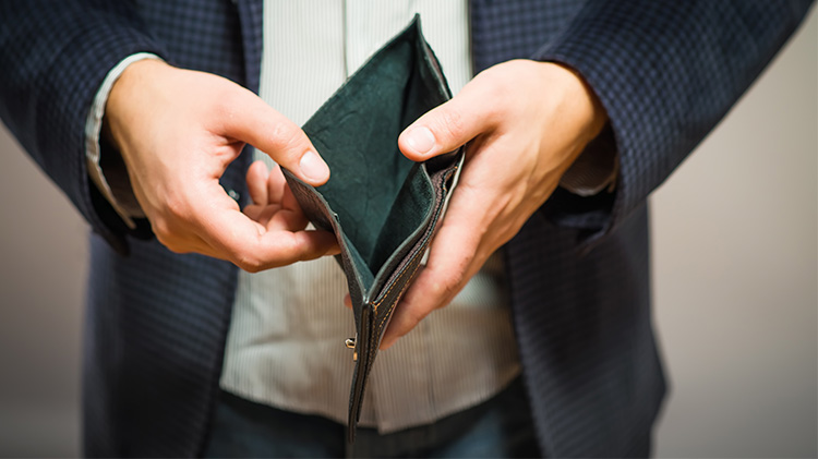 Man's hands holding an open wallet.