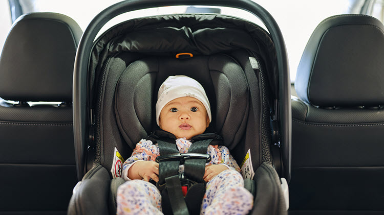 Baby in a car seat.