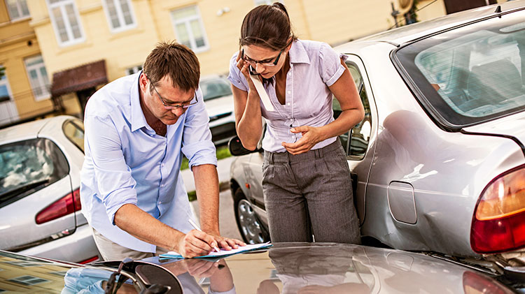 Drivers are filling out an accident report.
