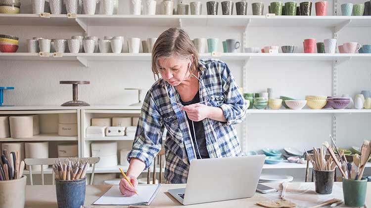 Freelancer takes notes about financial tips