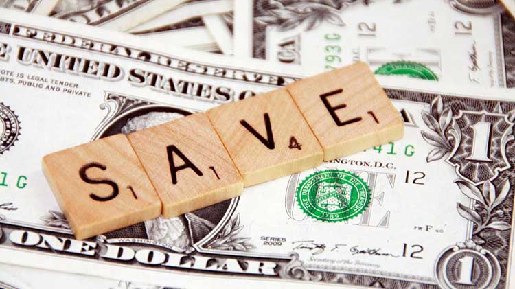 Dollar bill with blocks on top that spell SAVE.