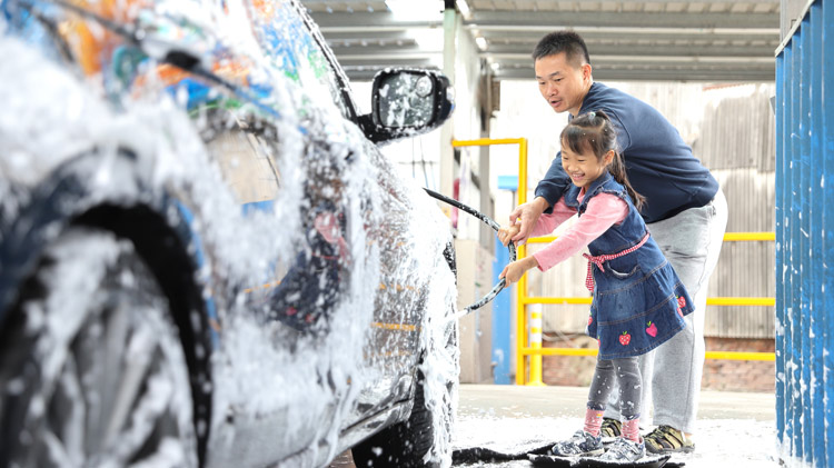 Family washing car.