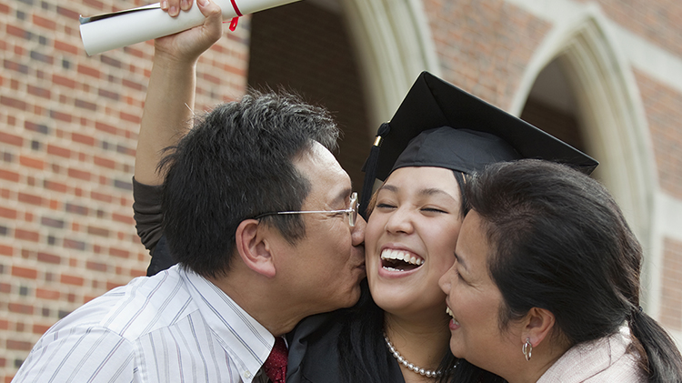 Man and woman with graduate.